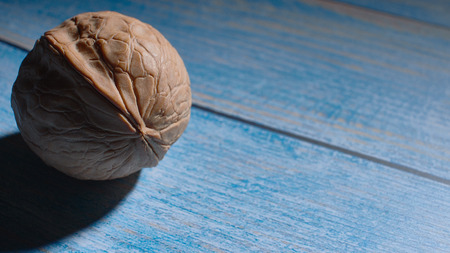 Healthy food concept, fresh nuts on the table Stylish closeup of walnuts.