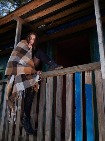 Brunette posing on the veranda in the autumn. autumn casual. Autumn fashion 
model.の写真素材
