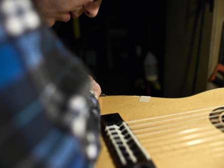 In the guitar workshop, Guitars Luthiers sets up a stand under the arm.の写真素材
