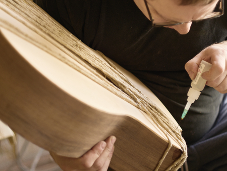The process of making a cutaway on a classical guitar.の写真素材
