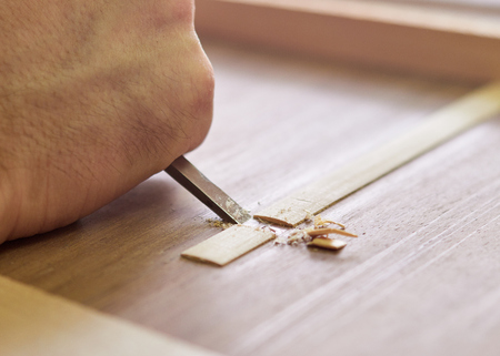 Marking and Pasting brace to the soundboard of a classical guitar. Production of classical guitar.の写真素材