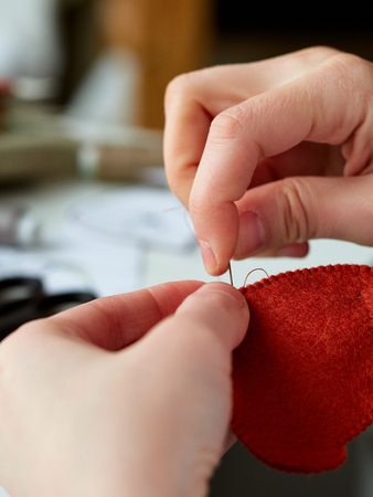 Step-by-step process of manual manufacturing baby crib mobile.