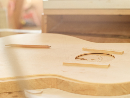 Marking and Pasting of footer and brace to the soundboard of a classical guitar. Production of classical guitar.の写真素材