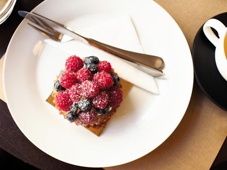 Berry brownie on a white plate.