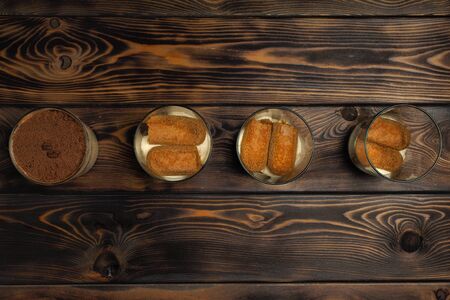 Recipe of preparation of a dessert of tiramisu, seventh part: "Filling of cups by a dessert".の写真素材