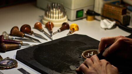 engraver engrave the drawing on the sketch.の写真素材