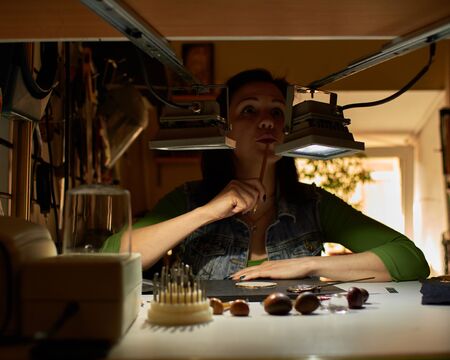 the engraver applies paste to the medal.の写真素材