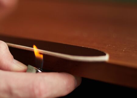 Edging the edge of a leather belt with fire.の写真素材