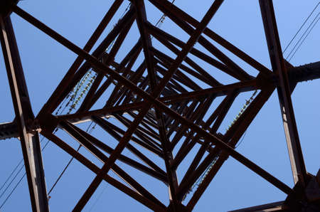 Transmission tower on blue sky background.