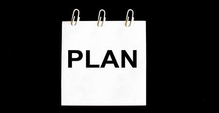 White stickers Plan on black background. Business concept