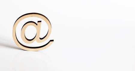 isolatet at sign with envelope on wood, symbol for mail. Signの写真素材