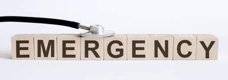 Medical stethoscope with wood block Emergency. Medicineの写真素材