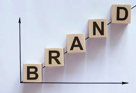 business concept text on wood block Brand on the chartの写真素材