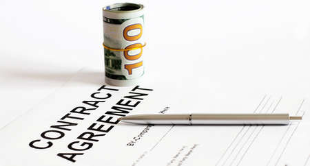 Sign contract for more money, US Dollar banknotes money on printed contract paper and pen to sign