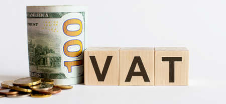 Business Concept with wooden blocks text VAT with money. Growing business startup concepts.の写真素材