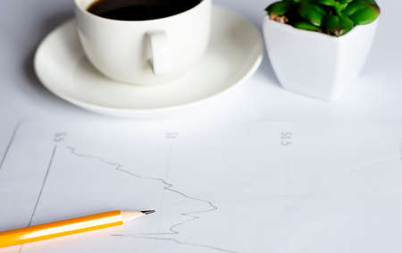 concept hand drawn on white blackboard with cup of coffee and pencilの写真素材