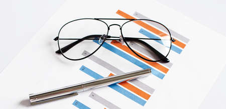Graph Of Stock Market With Pen and glasses. business concept.Businessの写真素材