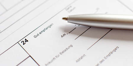 Applicant filling in business company application form document applying for job.