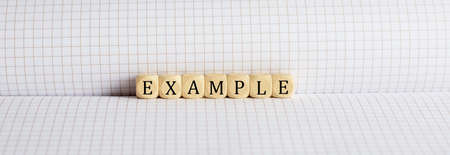 Concept EXAMPLE Words written on wooden block on notebook. Leadership concept.の写真素材