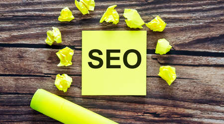 SEO. Notes about SEO, concept on yellow stickers on wooden backgroundの写真素材