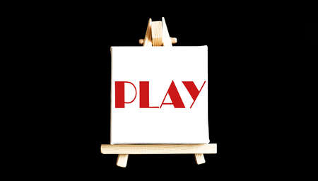 Word play written on easel on the black backgroungの写真素材