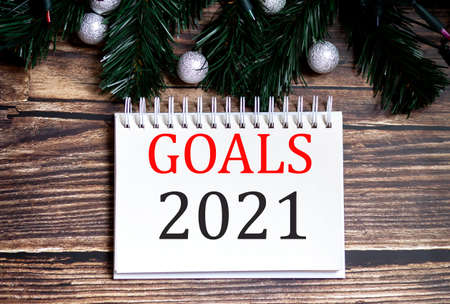 GOALS 2021 Christmas tree concept text words on the notepad