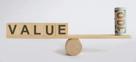 Seesaw Showing Balance Between money And word VALUE. Businessの写真素材