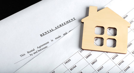 RENTAL AGREEMENT with wooden house on the chart chartの写真素材