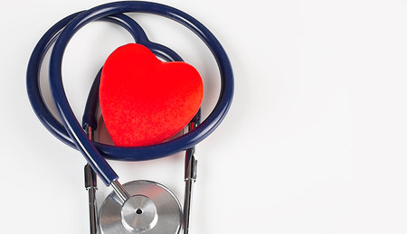 Medical stethoscope and heart isolated on white backgroundの写真素材