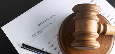 rental agreement form on the desktop with pen, and gavel