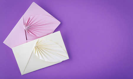 Colorful envelopes on the purple background. Top view.の写真素材