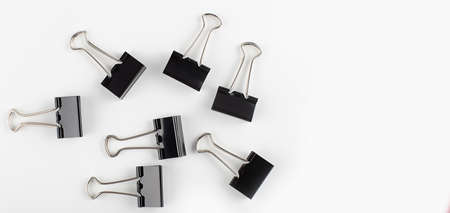 black binder clip on the white background. Close up view. Copy spaceの写真素材
