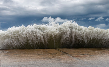 Storm in Sochi. Blu-green waves on the beach, close up