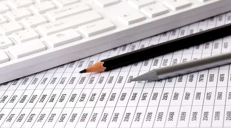 Business charts report with keyboard on the desk of financial advisor. Financial concepts.の写真素材