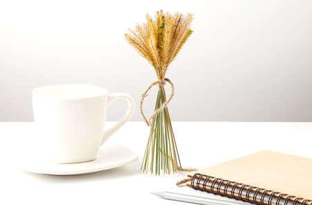 Desktop workplace designer, painter top view. Coffee, notebook on white backgroundの写真素材