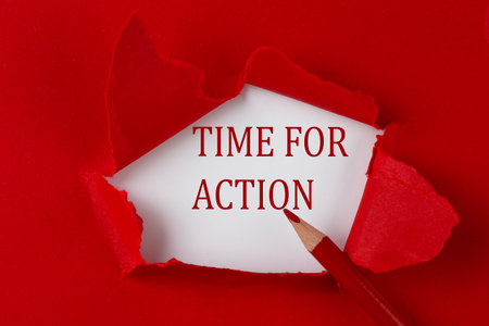 TIME FOR ACTION text on the red torn paper with red pencilの写真素材