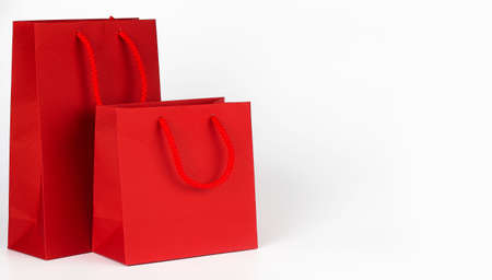 Red shopping bags isolated on the white background. Copy spaceの写真素材