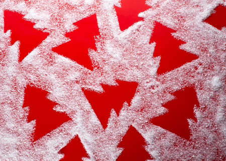 Red Christmas background with spruce snow pattern, decorativeの写真素材