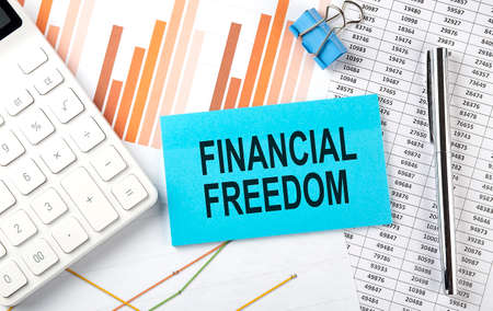 FINANCIAL FREEDOM text on sticker on diagram backgroundの写真素材