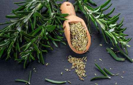 Fresh Rosemary and rosmaryspices on the black backgroundの写真素材