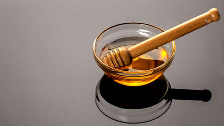 Honey on the black background. Copy space for textの写真素材