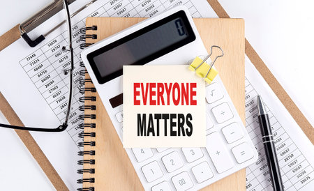 Everyone Matters word on a sticky with clipboard and notebook, business conceptの写真素材