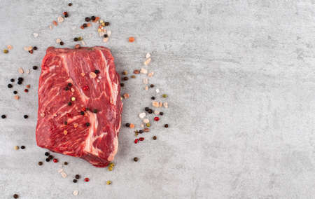 raw meat beef fillet and pepper on marble background , copy spaceの写真素材