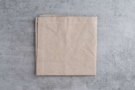 Gray background with gray textile napkin. Food background for recipe, cooking ingredients and restaurant design with copy spaceの写真素材