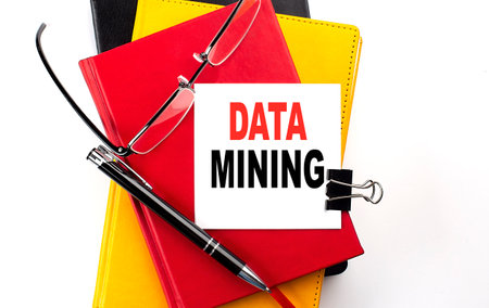 DATA MINING text written on sticky on colorful notebooksの写真素材