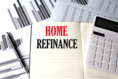 HOME REFINANCE text written on notebook on chart and diagramの写真素材