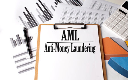 Paper with Anti-money laundering AML on a chart backgroundの写真素材