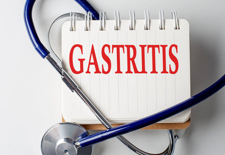 GASTRITIS word on a notebook with medical equipment on backgroundの写真素材