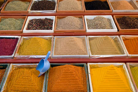 Square small boxes with spices in market