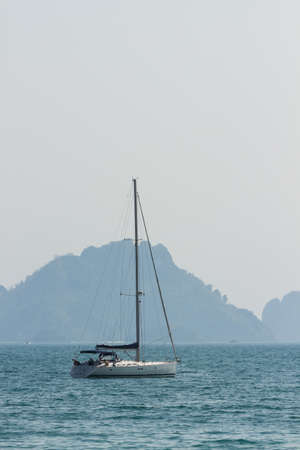 Yacht in Mediterranean sea on mountain blurry backgroundの写真素材